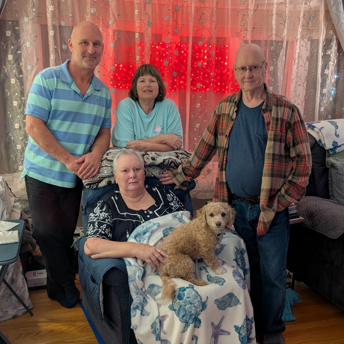 Photo of person living with ALS and her family.