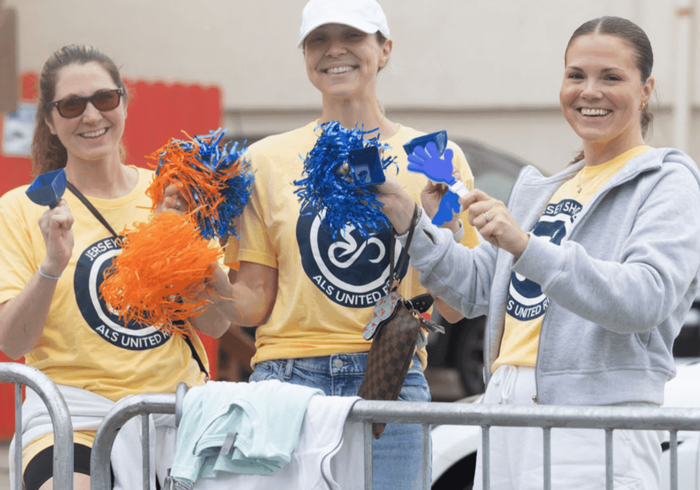Volunteers cheering at event.