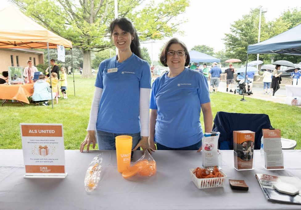 Two people pose at an ALS United Walk